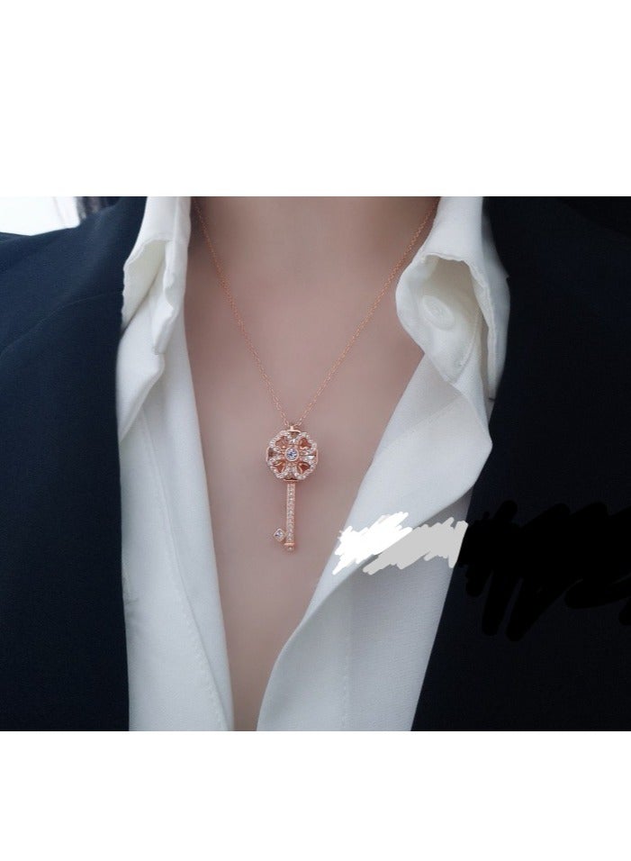 A pendant necklace in the shape of a key